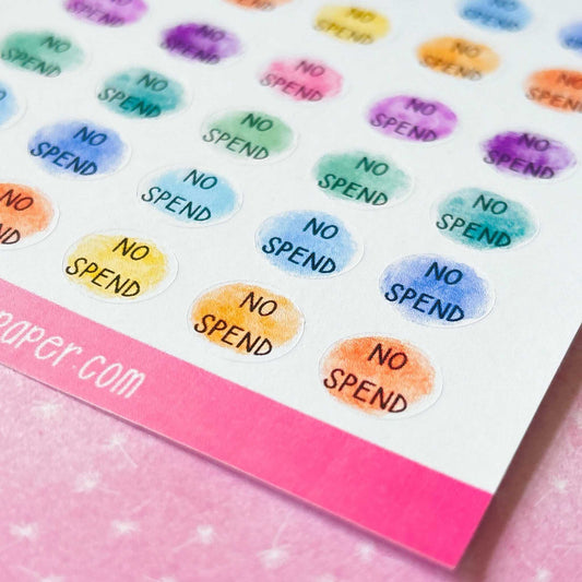 A sheet of vibrant "No Spend Planner Stickers," each with the text "NO SPEND." These economical stickers are arranged in rows and showcase pastel hues such as purple, pink, blue, green, and orange. Ideal for injecting some fun into your savings challenge or spending planner.