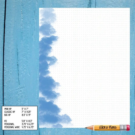 A Cloudy Notepaper with a blue cloud design border on the left. At the bottom left, a sizing chart lists various journal notebook dimensions. A pencil with an eraser, labeled "Elora Plans," is placed diagonally at the bottom right corner. The background is wooden.