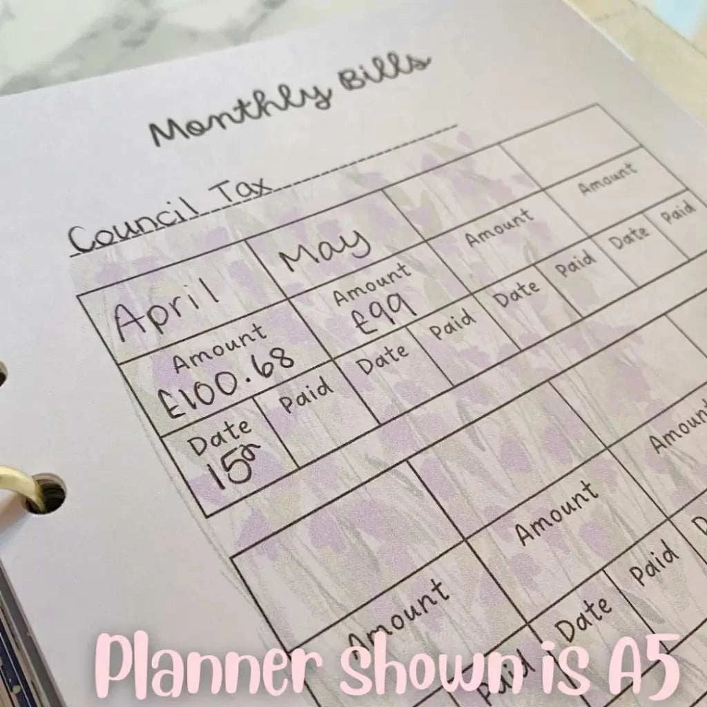 Image of an A5 planner page titled "Monthly Bills." The page has columns for tracking bill amounts and payment dates for April and May. The council tax amount for April is £100.68, paid on the 15th, and for May, it's £99 with a blank space for the payment date. This Household Bill Tracker helps manage monthly bills efficiently.
