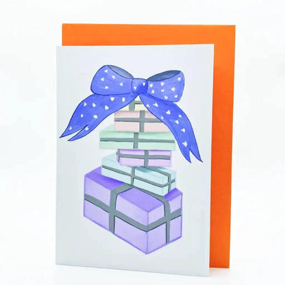 Illustration of the Pastel Birthday Card featuring stacked birthday gifts with blue ribbons, overlaid on an orange card.